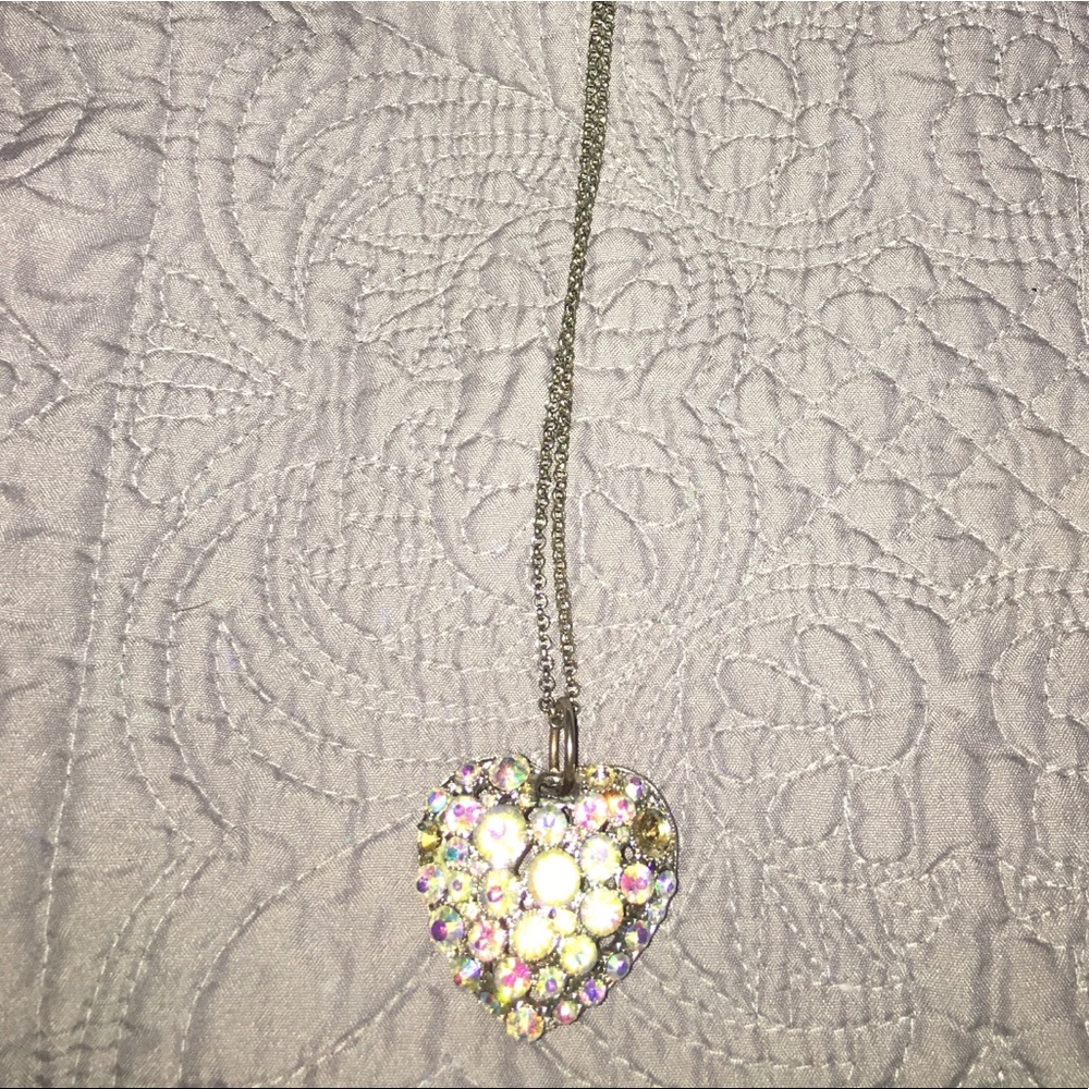 Long pendent shiny metal heart